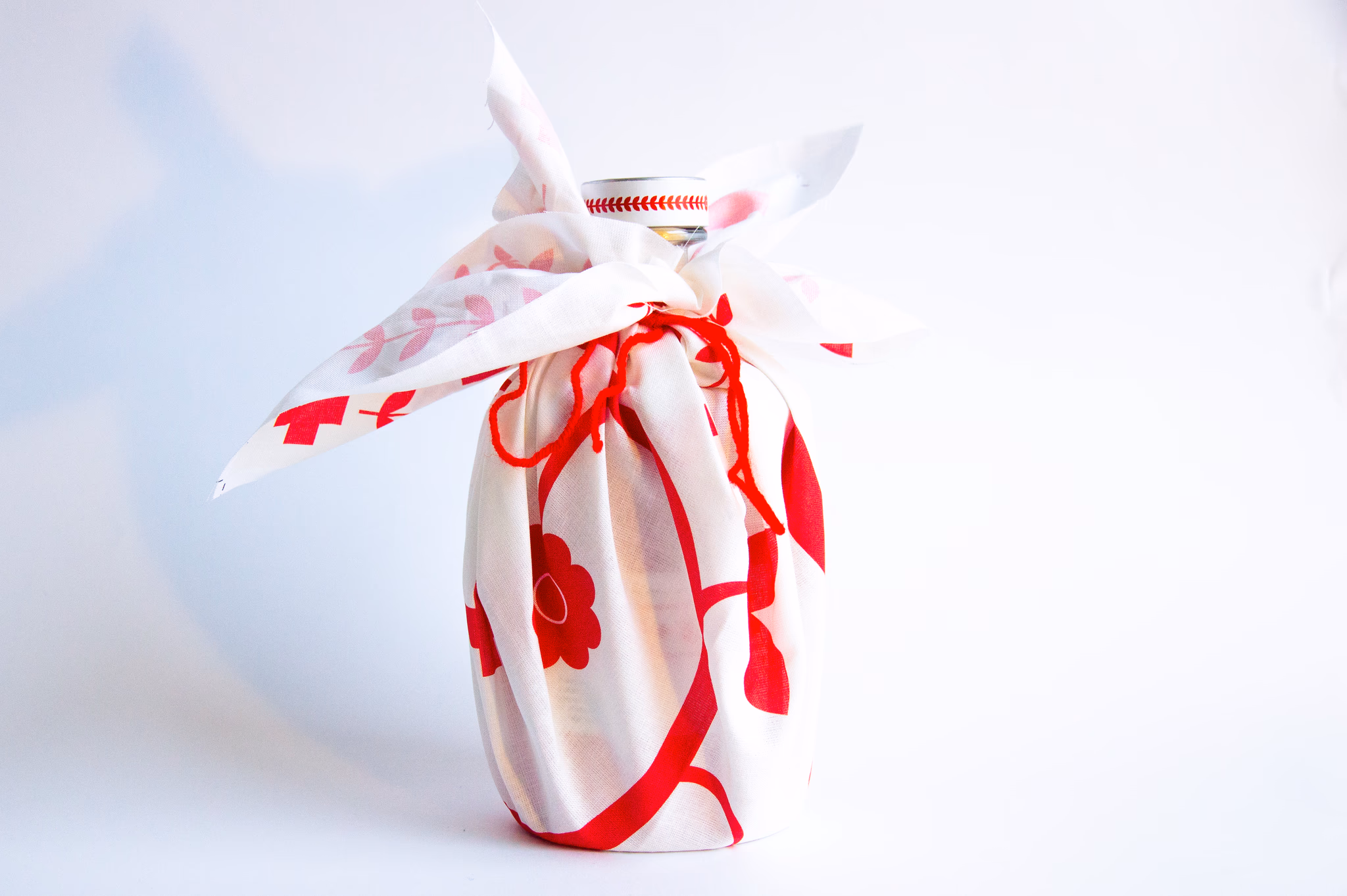 Lasowiak bottle photographed on a folk textile